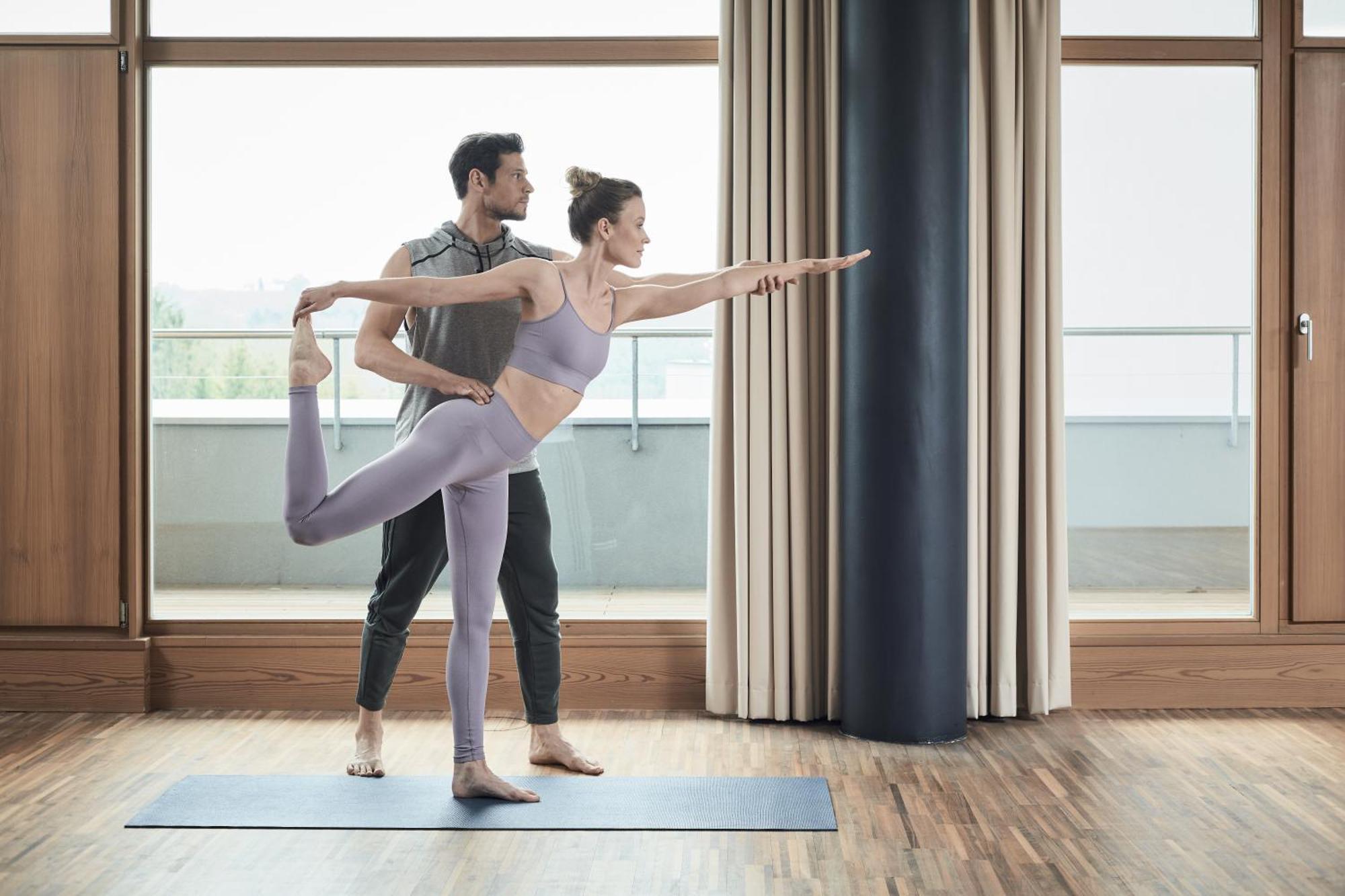 Falkensteiner Balance Resort Stegersbach - Adults Only Dış mekan fotoğraf A woman practicing yoga with a personal trainer